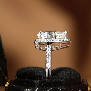 Elegant Moissanite Teardrop Ring in Sterling Silver with halo and pave band.