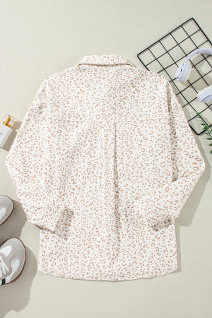Leopard print overshirt with collared neckline and button-down front.