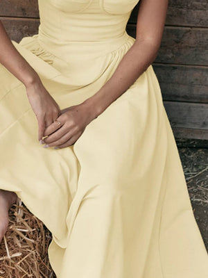 Pastel yellow sweetheart midi dress with spaghetti straps and ruched waist