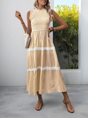 Yellow striped midi dress with smocked bodice and lace trim tiers.