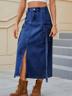 Dark blue denim midi skirt with high rise, slit, and cargo pockets.