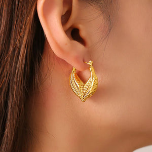 Textured gold leaf hoop earrings with 18K gold plating.