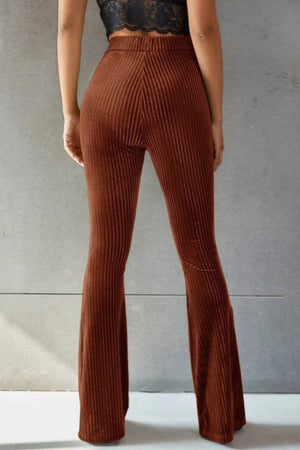 Brown ribbed velvet palazzo trousers with a flared leg