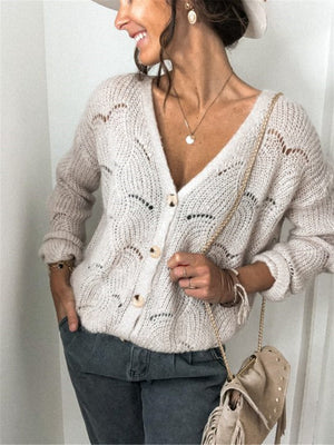 Beige scalloped knit button-down cardigan with openwork details and wooden buttons.