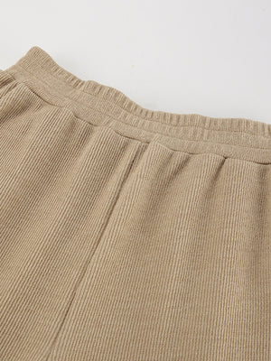 Beige ribbed knit pants with elastic waistband detail