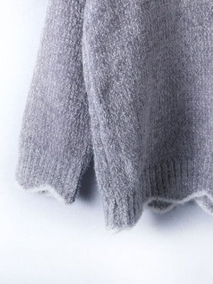 Gray acrylic knit sweater with scalloped trim detail on hem and cuffs.