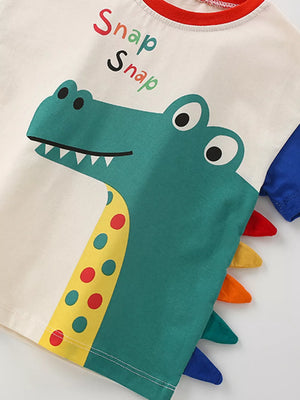 Toddler set with green dinosaur applique, polka dots, and colorful spikes.