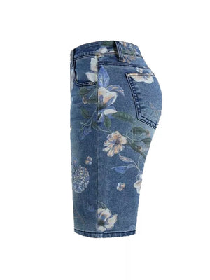 Blue denim shorts with a botanical print and relaxed fit.