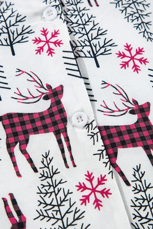 White pajama set with festive reindeer, snowflake, and tree print.