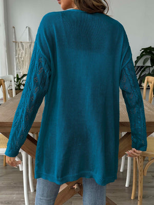 Peacock blue duster cardigan with openwork diamond knit sleeves and a longline cut.