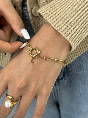 Gold chunky chain bracelet with an L initial charm and toggle clasp