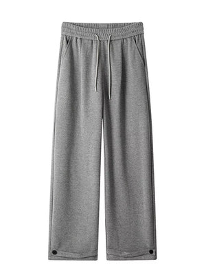 Relaxed fit grey herringbone sweatpants for men with drawstring and ankle cuffs.