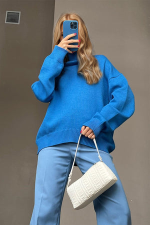 Oversized royal blue cashmere turtleneck sweater with ribbed cuffs and hem.