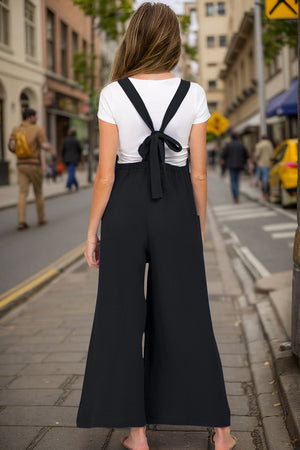 Black wide-leg jumpsuit with tie-back straps and textured fabric