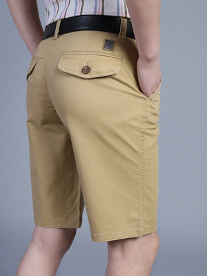 Khaki chino shorts for men with pockets and a button-flap back pocket.