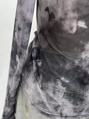 Edgy asymmetrical t-shirt in gray black tie-dye mesh with butterfly print and denim accents.