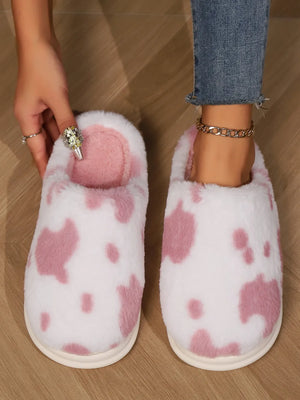 Blush pink cow print faux fur house slides with soft lining.