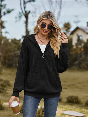 Black textured knit dolman sleeve zip-up hoodie with pockets and drawstring hood.