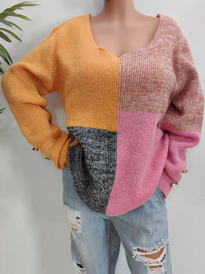 Colorblock knit sweater in sherbet with button cuffs and a v-neck.