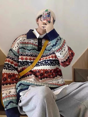 Geometric knit sweater with a collared neckline and abstract pattern in navy blue and brown tones.