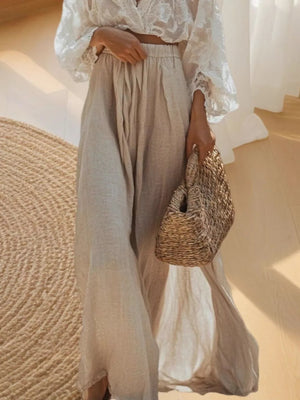 Elegant lace crop top with apricot linen maxi skirt and straw bag