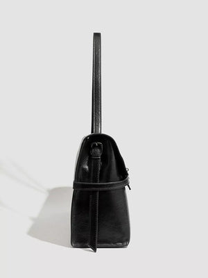 Black pu leather shoulder bag with buckle detail and adjustable strap
