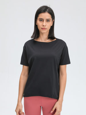 Black relaxed fit performance tee with boat neck and short sleeves.