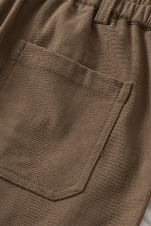 Caramel seamed front wide leg trousers with a back pocket detail.