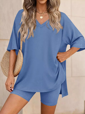 Blue V-neck two-piece set with relaxed fit top and biker shorts.