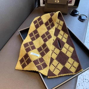 Cozy argyle pattern wool scarf in brown and yellow with a small slit detail.