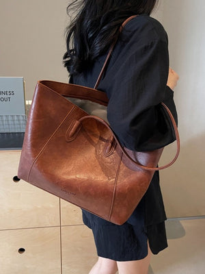 Premium crinkled pu leather tote bag in coffee brown with twin top handles and a slouchy silhouette.