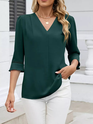 Dark green V-neck blouse with 3/4 sleeves featuring lace trim detail.