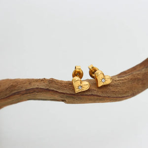 Gold heart stud earrings with diamond accent detail