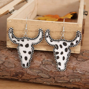 Cow print bull head drop earrings with silver trim and beaded edge