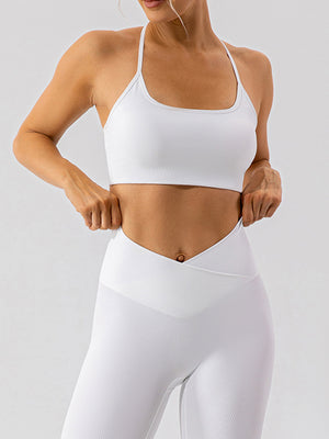 White ribbed halterneck active bra with a square neckline and thin straps.