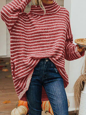 Oversized striped turtleneck sweater in Deep Red with slouch pockets, styled with jeans.