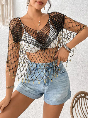 Black crochet cardigan with gold beads and fringe detail, V-neck, short sleeves.