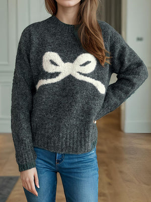 Dark gray acrylic knit sweater with a white intarsia bow design.