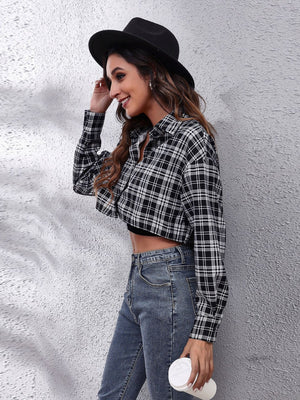 Plaid cropped shirt jacket with button front and collar, styled with jeans.