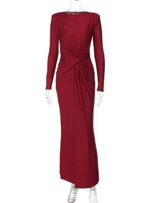 Red long sleeve ruched knot front maxi dress with a draped neckline.
