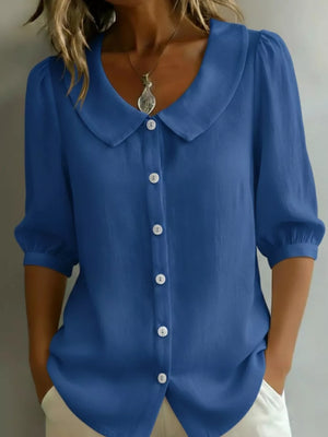 Royal blue button-down shirt with Peter Pan collar and puff sleeves.
