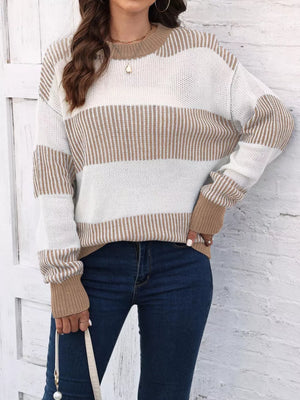 Cozy knit sweater with tan and white stripes, crew neck, and long sleeves.