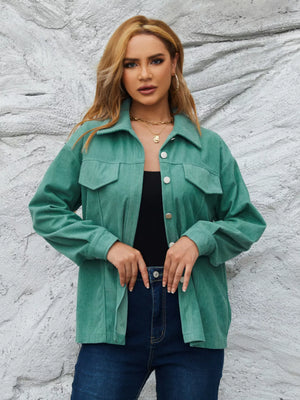 Textured corduroy button-up jacket in Peacock Green with two chest pockets and silver buttons.