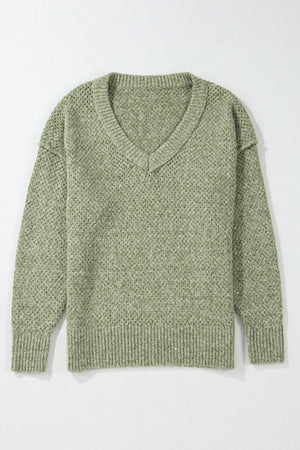 Open-knit slouchy V-neck sweater in matcha green with ribbed cuffs and hem.