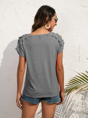 Gray t-shirt with lace shoulder detail and short sleeves.