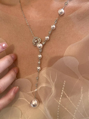 White pearl flower Y-necklace with clear crystal accents and a large pearl drop.