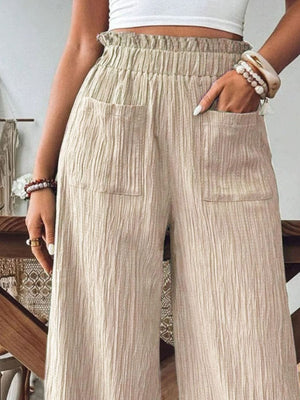 Khaki textured wide-leg palazzo trousers with elastic waist and pockets.