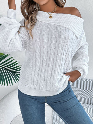 White off-shoulder cable knit pullover sweater with a wide neckline.