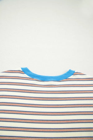 Casual striped mini dress with pockets, cream with blue, red, and navy stripes and a blue neckline.