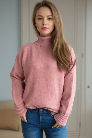 Blush pink speckled Donegal turtleneck pullover sweater with ribbed cuffs and hem.